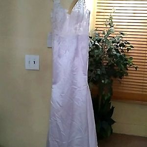 Beautiful white fitted lace wedding dress with a small train
